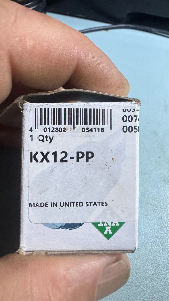 INA KX12-PP box label close-up: part number, EAN barcode, made in United States
